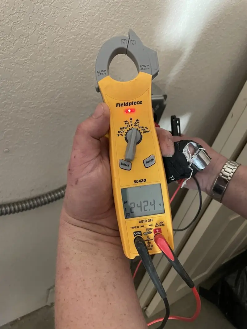 Voltage testing with clamp meter during Recessed Lighting Installation in Toccoa